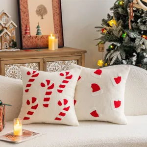 Festive Christmas embroidered throw pillow case with holiday candy cane and hat details.