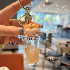 Simpatico portachiavi tazza tè boba liquido con perline galleggianti e graziosa bambola.