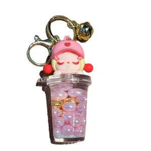 Grazioso portachiavi tazza tè al latte liquido con ciondolo ragazza cartone animato rosa.