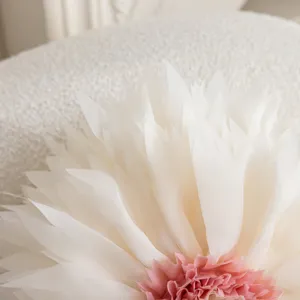 3D lotus flower decorative pillow cover detail showing soft white and pink fabric petals.