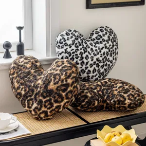 Leopard print heart-shaped plush pillow soft fleece cushion for living room sofa bedroom decor.