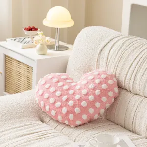 Pink heart-shaped throw pillow cover with white polka dots, soft plush cushion for sofa.