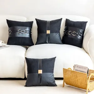 Detailed view of luxury black faux leather decorative sofa pillow cover with metal buckle accent.