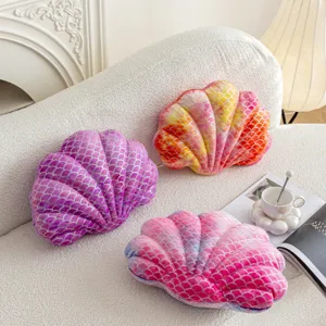 Shell plush pillow detail shot showing gradient tie-dye colors and fine scale texture.