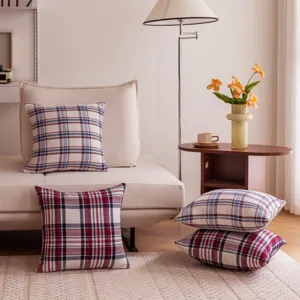 Detail view of plaid throw pillow cover, classic tartan cushion for living room sofa decor.