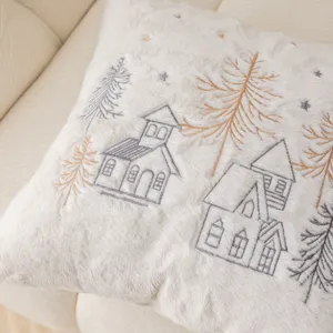 Detailed view of plush Christmas embroidered throw pillow cover, cozy winter village design.