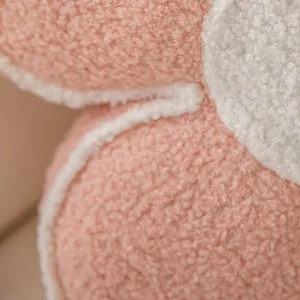 Plush petal pillow fabric detail shot showcasing soft sherpa texture and neat stitching.