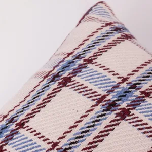 Detailed shot of a classic plaid sofa pillow cover fabric, showing soft texture and pattern.