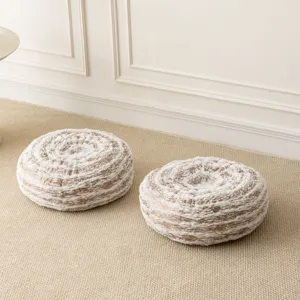 Round decorative floor cushion with textured gold and white design for cozy home living spaces.