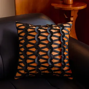 Funda de cojín tejida de cuero negro y naranja de lujo europeo para decoración de sofá.