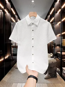 Men's white short sleeve textured button-up casual shirt for summer fashion wear.