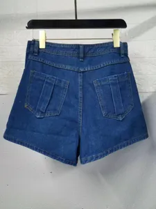 Detail view of plus size high waist denim shorts featuring back pockets and belt loops.