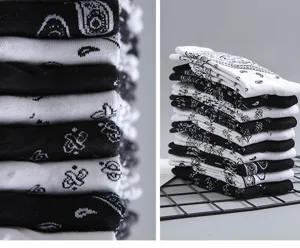 Black and white paisley pattern mid tube streetwear cotton socks, trendy casual design.