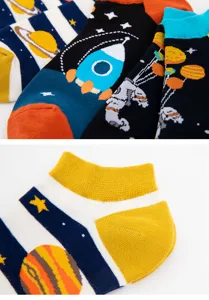 Detailed view of men's cotton short socks featuring creative space rocket and planet prints.