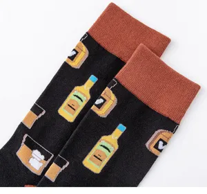 Close-up detail of men's casual crew socks featuring whiskey bottle and ice glass patterns.