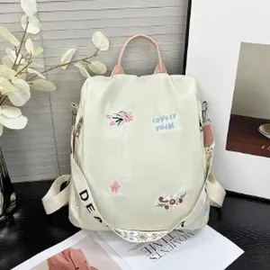 Fashion nylon backpack with floral embroidery and large capacity for women daily use.