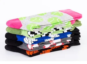 Detailed view of men's colorful novelty sport crew socks with various ball patterns.