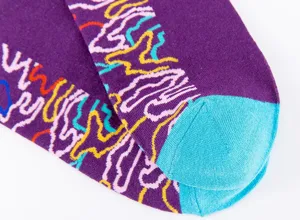 Detailed view of men's purple cotton socks with colorful abstract lines and blue heel.