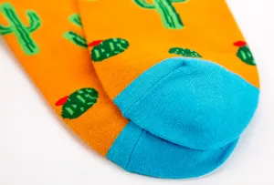 Colorful cartoon cactus pattern long socks with contrasting blue toe for men and women daily wear.
