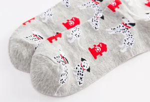 Men's cotton socks detail view featuring cute dalmatian dogs and red fire hydrants print.