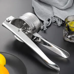 Stainless steel potato masher detail showing durable metal press and kitchen tool utility.