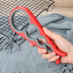 Apribarattoli multifunzionale e apribottiglie, pratico strumento da cucina in plastica.