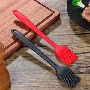 Silicone basting brush detail showing thick bristles, ergonomic handle, and hanging hole for kitchen baking.