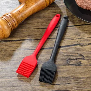 Silicone basting brush detail showing soft bristles and ergonomic handle for baking and cooking.