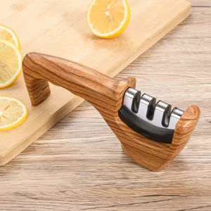 Portable wood grain knife sharpener for kitchen home use with multi-stage sharpening slots.