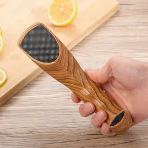Detail view of portable wood grain knife sharpener with mesh grinding surface for kitchen.