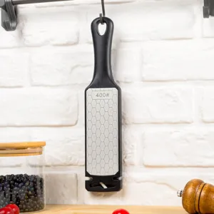Detail view of black kitchen knife sharpener with 400 grit diamond surface and hanging hole.