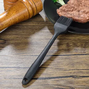 Thickened black silicone basting brush for kitchen baking, barbecue, and cooking oil application.
