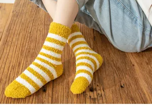 Cozy coral fleece striped socks for women, soft warm winter mid-tube socks for home use.