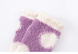 Soft coral fleece fuzzy socks for women winter warm polka dot sleep socks detail view