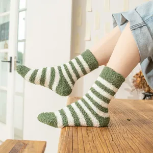 Cozy coral fleece women's mid-tube socks with green and white stripes, perfect for autumn and winter.