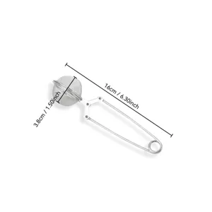 Stainless steel tea infuser mesh ball with squeeze handle for brewing loose leaf tea easily.