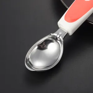 Stainless steel ice cream scoop detail, showing the polished bowl and comfortable handle.