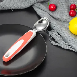 Stainless steel ice cream scoop with ergonomic red and white handle for easy kitchen use