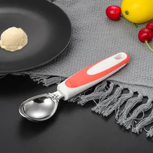 Stainless steel ice cream scoop detail view, durable kitchen tool with ergonomic handle.