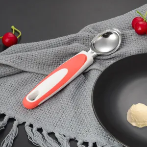 Stainless steel ice cream scoop with red white handle, durable kitchen tool for home dessert use.