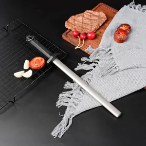 Detail shot of handheld diamond sharpening steel rod for quick kitchen knife sharpening, durable.