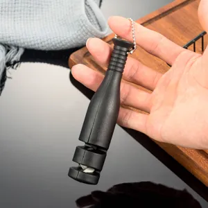 Portable mini knife sharpener detail showing dual stage sharpening mechanism clearly.