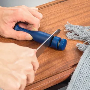 Detail view of the multi-functional 2-stage handheld kitchen knife sharpener with tungsten steel.