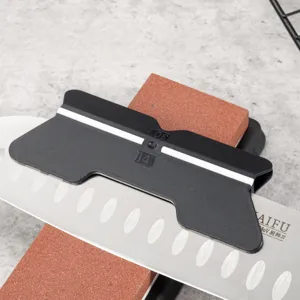Knife sharpening angle guide tool with whetstone and kitchen knife for precise sharpening.