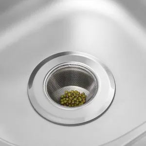 Stainless steel kitchen sink strainer basket close-up view, effective anti-clogging drain filter.