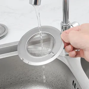 Stainless steel kitchen sink strainer detail, fine mesh design for efficient debris filtration.