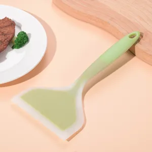 Dual-color silicone spatula, wide design for steak, pancakes, and eggs, heat-resistant tool.