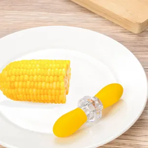 Handheld corn stripper kitchen gadget featuring yellow handle for easy kernel removal