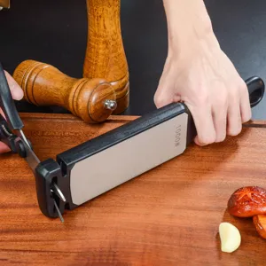 Detail view of a handheld diamond knife sharpener with 1000 grit for kitchen scissors and tools.