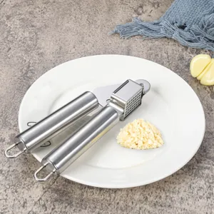 Stainless steel manual garlic press kitchen tool for easy mincing and crushing at home daily
